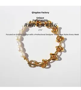 Detail of baroque pearl and gold plated brass link chain bracelet with toggle clasp