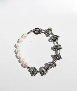 Detail of freshwater pearl and silver knot chain bracelet with functional OT toggle clasp