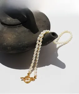 Detail of freshwater rice pearl necklace with a vintage golden toggle OT clasp