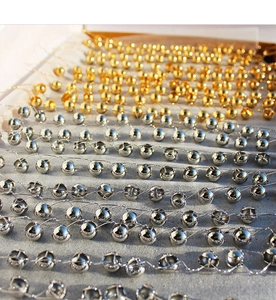 Detailed view of mirror-polished hollow spherical earrings in gold and silver finishes