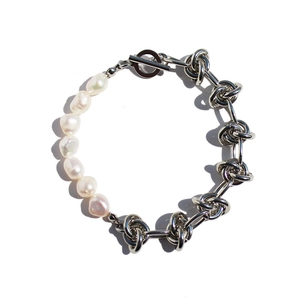 Baroque pearl and silver knotted chain bracelet with a vintage toggle clasp closure