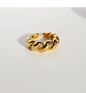 Close-up of vintage gold twisted croissant ring with a polished adjustable open design