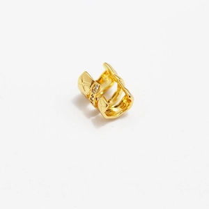 Golden ear cuff with rippled texture and zircon stars in a minimalist Korean style
