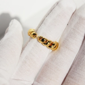 Vintage gold rope twisted open ring with a polished metallic finish and adjustable design