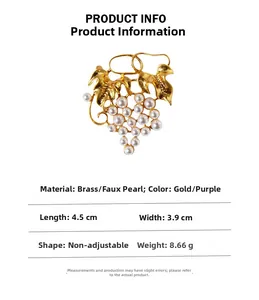 Detail view of brass pearl grape brooch with dimensions 4.5cm and 3.9cm shown on white background