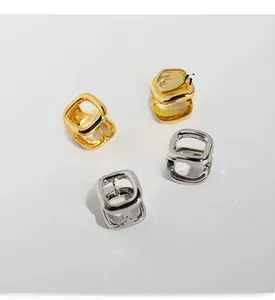 Detailed view of geometric square hoop earrings in gold-plated brass with premium zircons