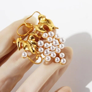 Elegant gold brass grape brooch featuring pearls and vine leaf details for women