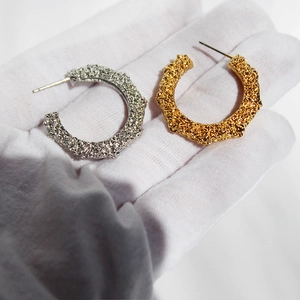 Irregular hammered texture C-shaped hoop earrings in gold and silver finish
