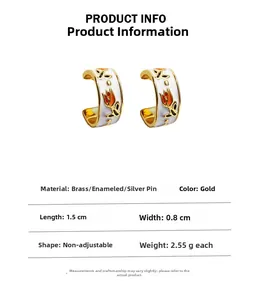 Detail showing white enamel tulip earrings with brass gold plating and size dimensions