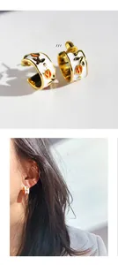 Detailed view of handmade enamel tulip C-shape earrings with gold plating and zircon
