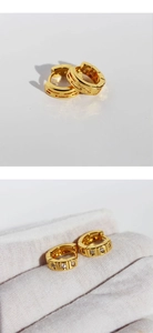 Detail of 24k gold plated brass hoop earrings with micro-inlaid zircon geometric accents