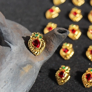 Vintage heart red gemstone earrings with gold twisted frame and green zircon accents