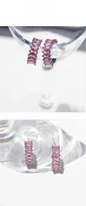 Detail showing elegant pink zircon C-shaped earrings with rectangular cut stones