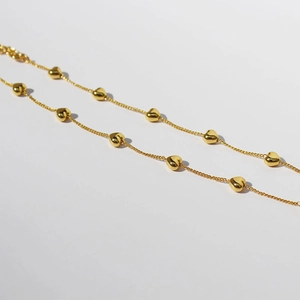 Elegant gold choker necklace featuring 3D heart charms with a polished finish for women
