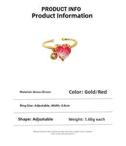 Detail of adjustable brass ring with gradient pink heart zircon and small round pendant