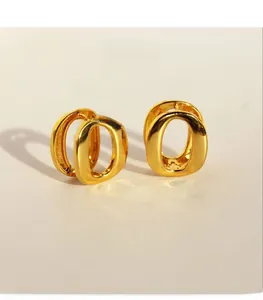 Detailed view of gold-plated brass oval earring featuring sparkling zircon stones