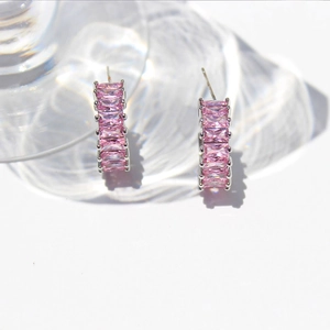 Luxury C-shaped earrings with pink baguette-cut zircons and silver-tone finish