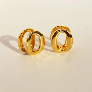 Minimalist geometric gold-plated oval hoop earrings with a polished double-ring design