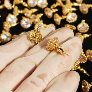 Single large clear zircon stud earrings with gold claw setting and crown design detail