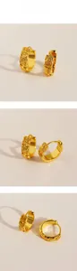 Detailed views of vintage gold hoop earrings with embossed floral and leaf patterns