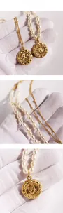 Detail of vintage gold medallion necklace with freshwater pearls and relief pendants