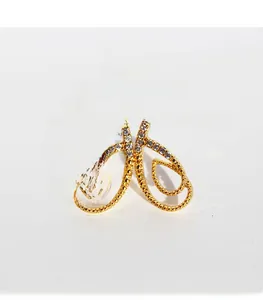 Macro shot of gold plated brass butterfly earrings with premium cubic zirconia stones