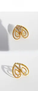 Detail of gold heart stud earrings featuring zircon pavé and beaded edge craftsmanship
