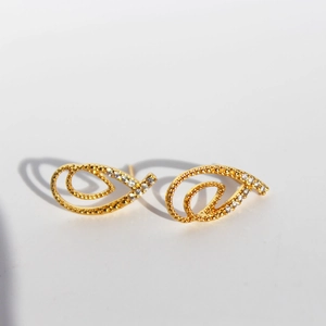 Elegant gold hollow leaf earrings with pavé zircon stones and a spiral design