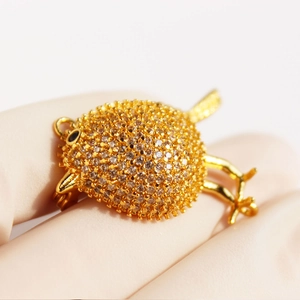 Exquisite gold bird brooch pendant with full micro-paved zircons and black stone eye