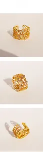 Détail d'une bague vintage française avec motifs de dentelle dorée et zircons fins