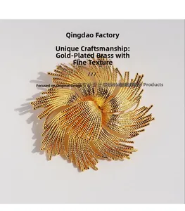 Detailed macro view of brass gold-plated floral brooch with shimmering zircon accents