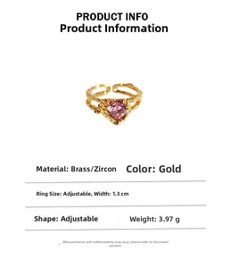Detail view of pink zircon heart ring in textured brass with size and weight specs
