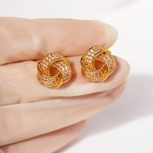 Elegant gold-tone knot stud earrings with pave-set sparkling zircons for women