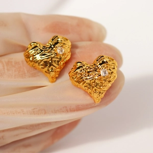 Lava texture gold heart earrings with zircon inlay and irregular metallic finish