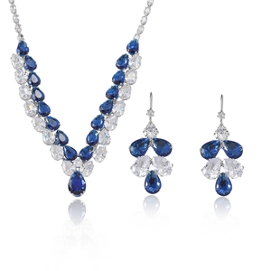 Elegant silver jewelry set with blue pear-cut crystals and necklace earring fringe design