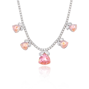 Pink heart-cut zircon necklace with sparkling silver setting on white background