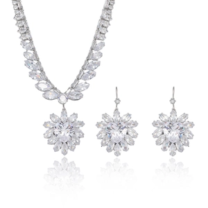 Elegant zircon heart necklace and earrings set with marquise stones on white background
