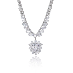 Luxury silver heart necklace with petal zircon pendant on a white reflective surface