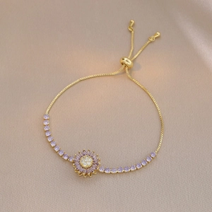 Detail of adjustable sunflower bracelet with purple crystals and 18K gold plated chain