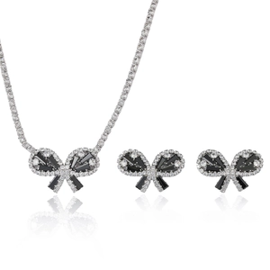 Elegant jewelry set with black butterfly zircon necklace and earrings on white background
