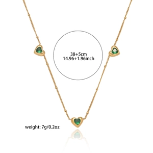 Golden heart necklace set with green zircon stones and beaded chain detail