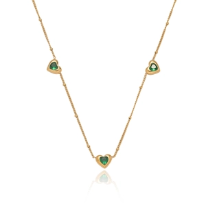 Gold necklace with three green heart gemstones and bead accents on a white background