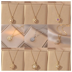 Elegant rotating flower pendant necklaces in gold and silver with colorful gemstones