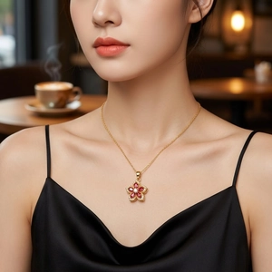 Rotating purple zircon flower necklace in gold plating worn by model in elegant setting