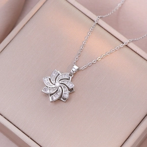 Rotating heart flower necklace with cubic zirconia pendant in silver finish