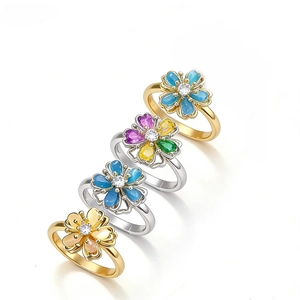 Rotating flower rings with blue cat eye stone and zircon in gold and silver plating