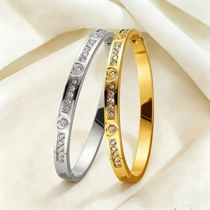 Polished titanium steel bracelets with pavé heart pattern in gold and silver finish