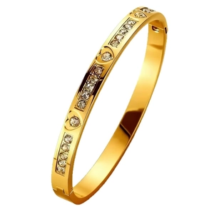 Polished gold heart bangle with geometric engravings and sparkling inset rhinestones