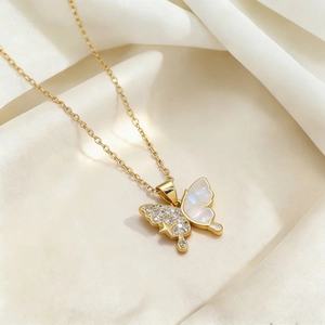 Titanium butterfly necklace with zircons and white shell inlay on silk fabric