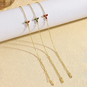 Gold stainless steel chain bracelet with emerald green flower petals and lobster clasp